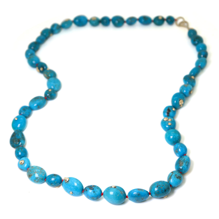 Turquoise beaded necklace with gold barnacles by Hannah Blount