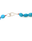 Kingman turquoise necklace with coral-hued silk and silver clasp by Hannah Blount