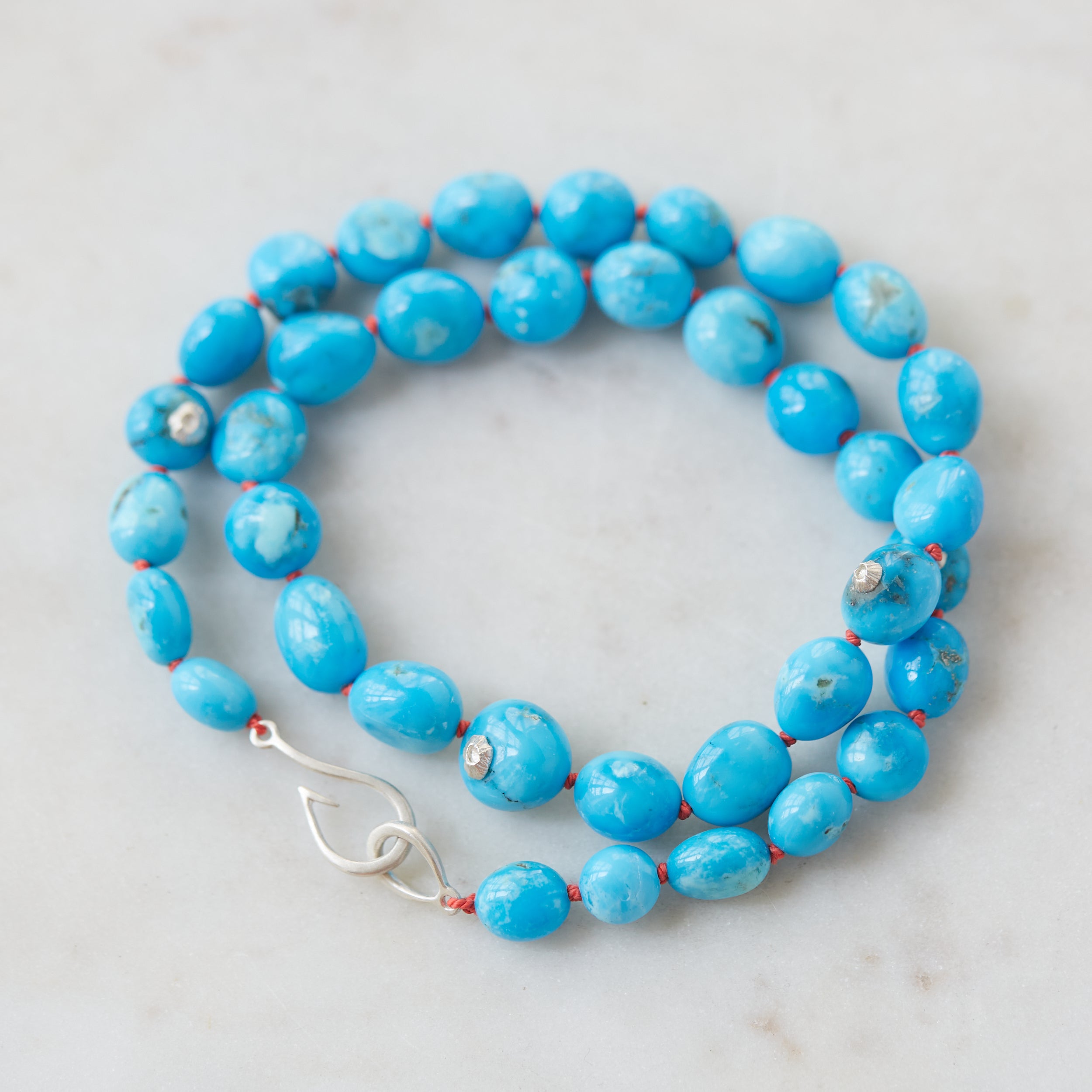 Kingman turquoise necklace with coral-hued silk and silver clasp by Hannah Blount