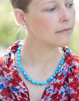 Kingman turquoise necklace with coral-hued silk and silver clasp by Hannah Blount