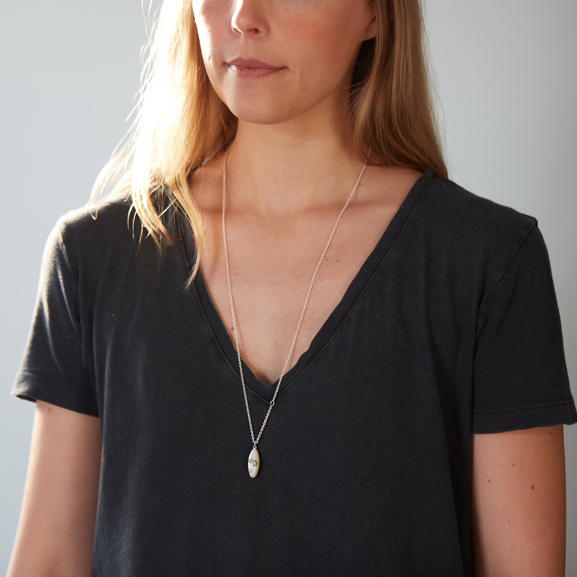 medium Mother of pearl necklace by Hannah Blount- on person