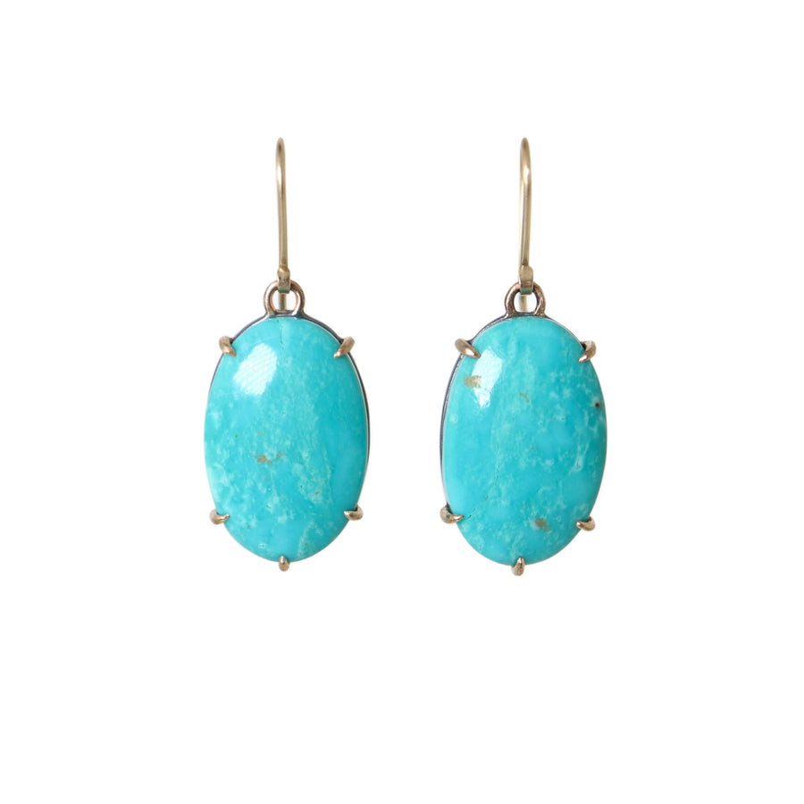 teal kingman turquoise earrings set in gold prongs