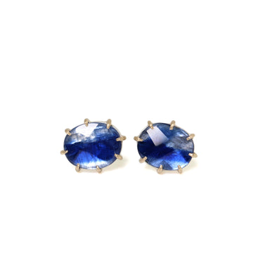 oval blue kyanite stud earrings with gold prongs and ear posts
