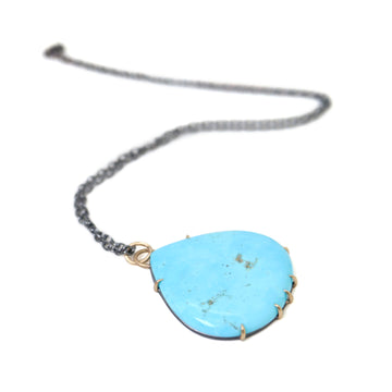grand teardrop turquoise necklace set in gold prongs