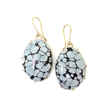 drop earrings of pale blue variscite gemstones with deep dark matrices, set in gold prongs