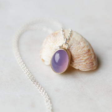 detail of Purple chalcedony nautical gold and silver necklace with barnacles and diamonds