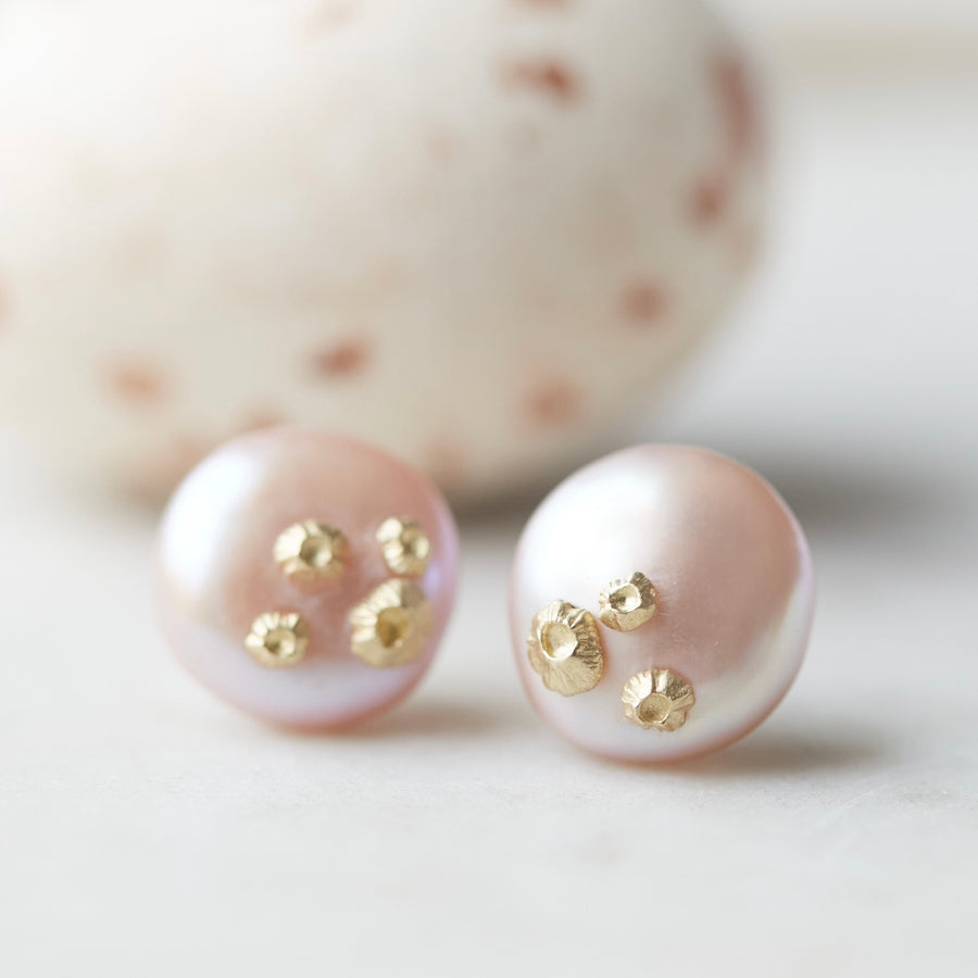 large pink button freshwater pearl studs with gold barnacles by hannah blount jewelry