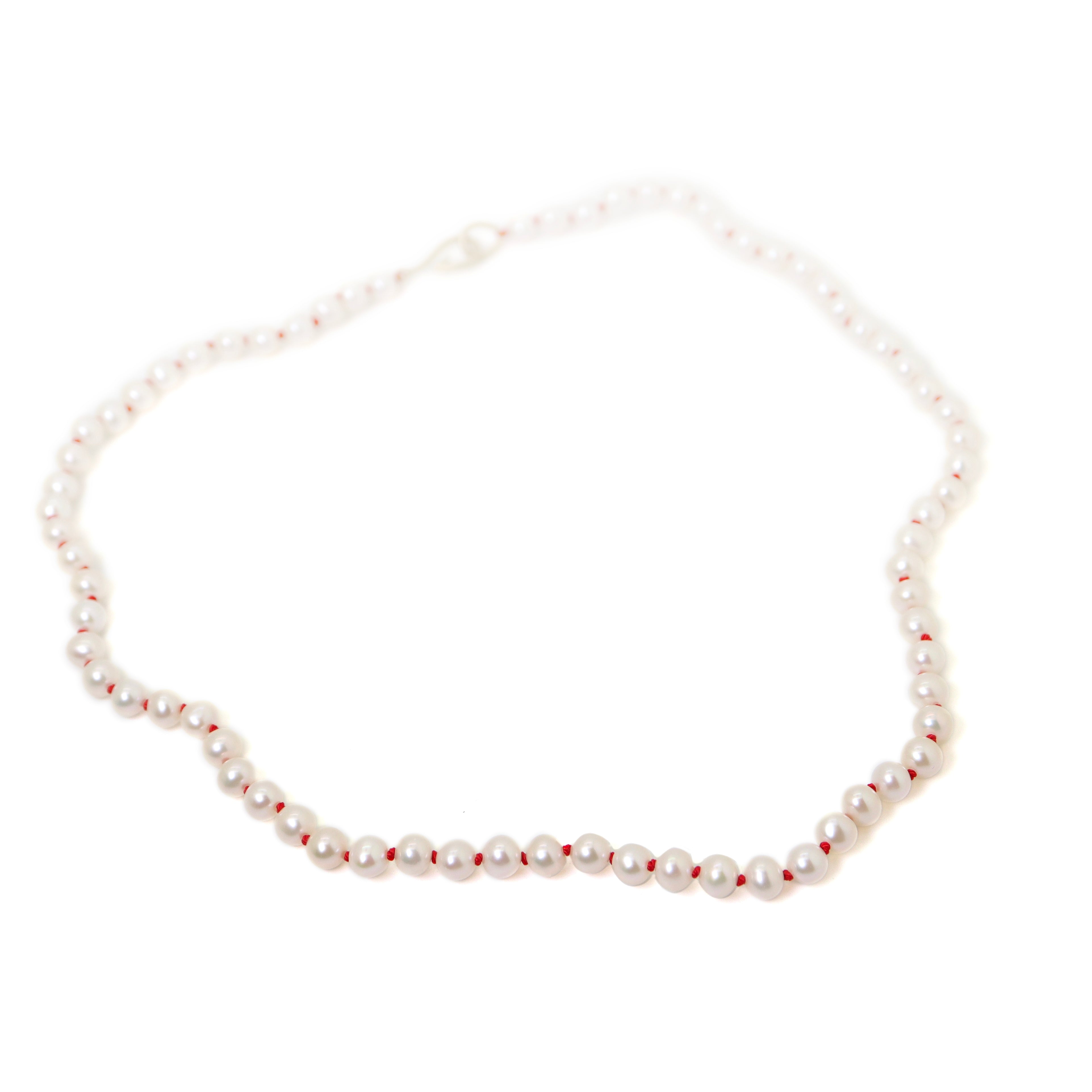 Freshwater pearls with coral thread