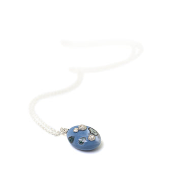 mottled blue common opal pendant with silver barnacles on a silver chain