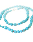 Kingman turquoise double-strand necklace with coral-hued silk and silver clasp by Hannah Blount