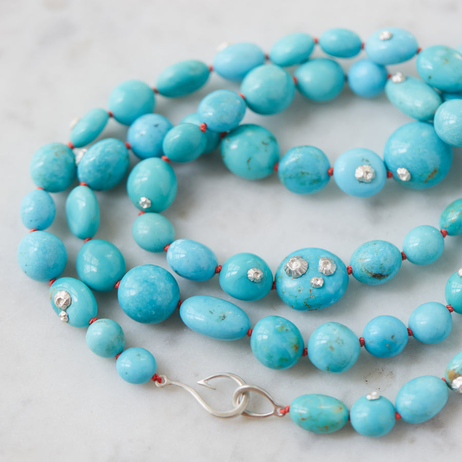 Kingman turquoise double-strand necklace with coral-hued silk and silver clasp by Hannah Blount