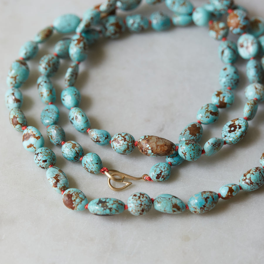 detail of Kingman turquoise necklace red silk by Hannah Blount