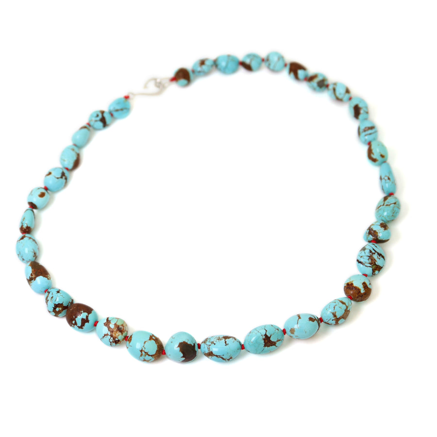 Kingman Turquoise strand with red silk by Hannah Blount