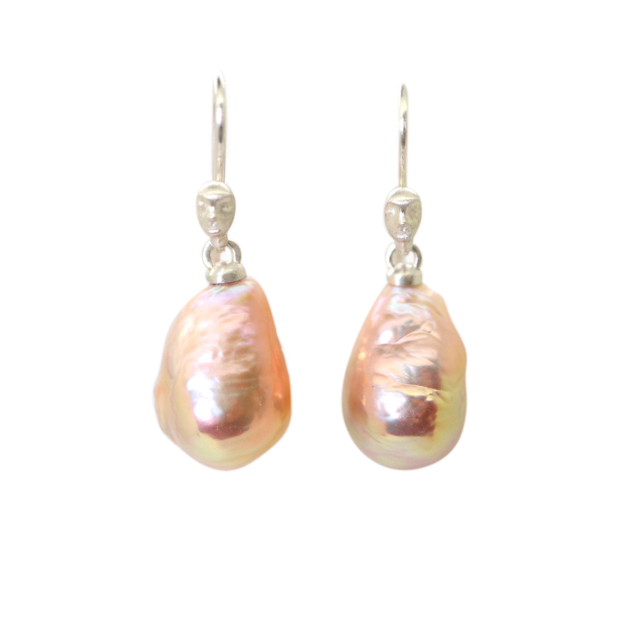 peach freshwater baroque pearl drop earrings with silver ear wires with cameo faces by hannah blount jewelry