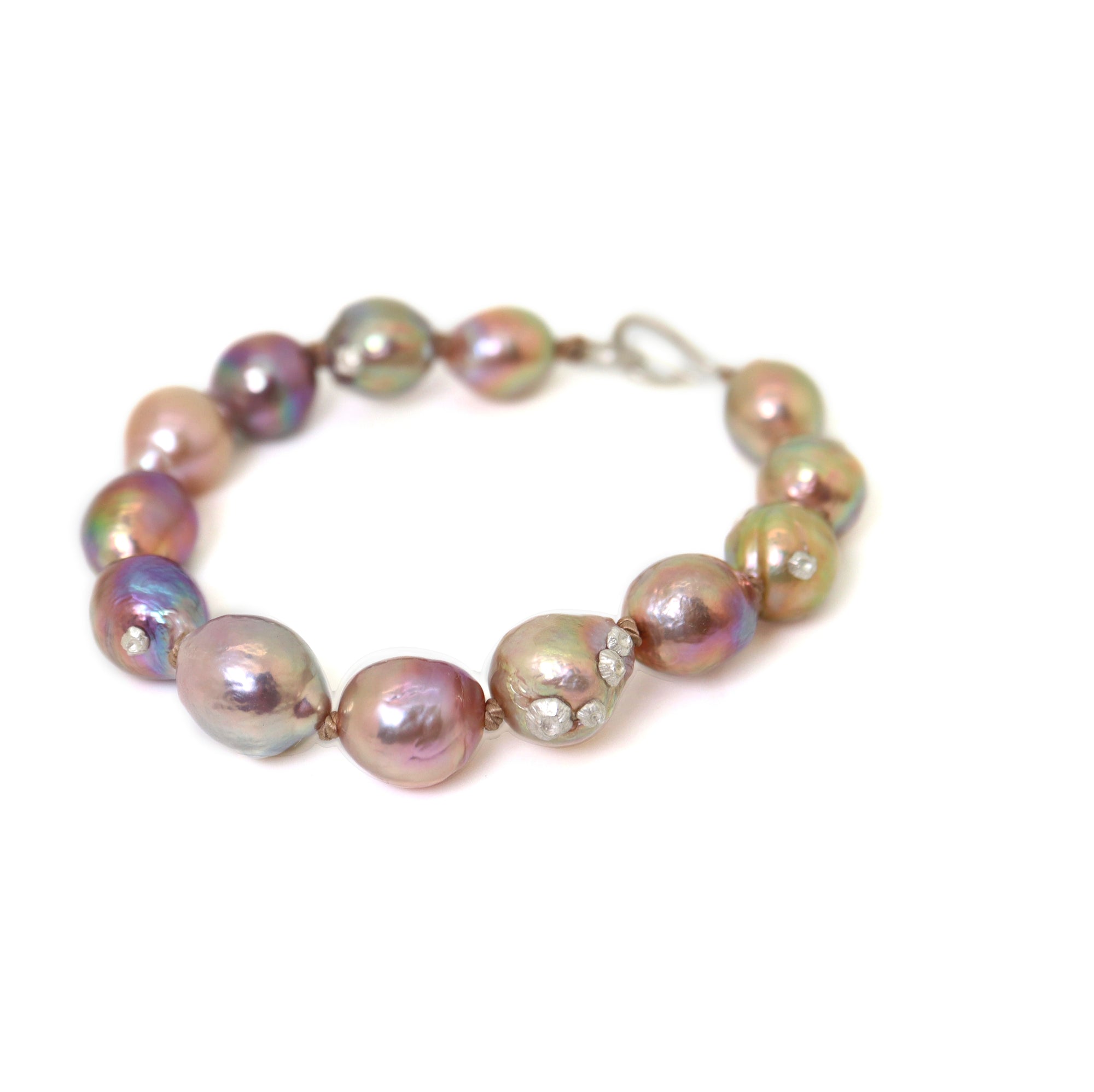 Pink freshwater pearl bracelet with silver barnacles and fish hook clasp by Hannah Blount