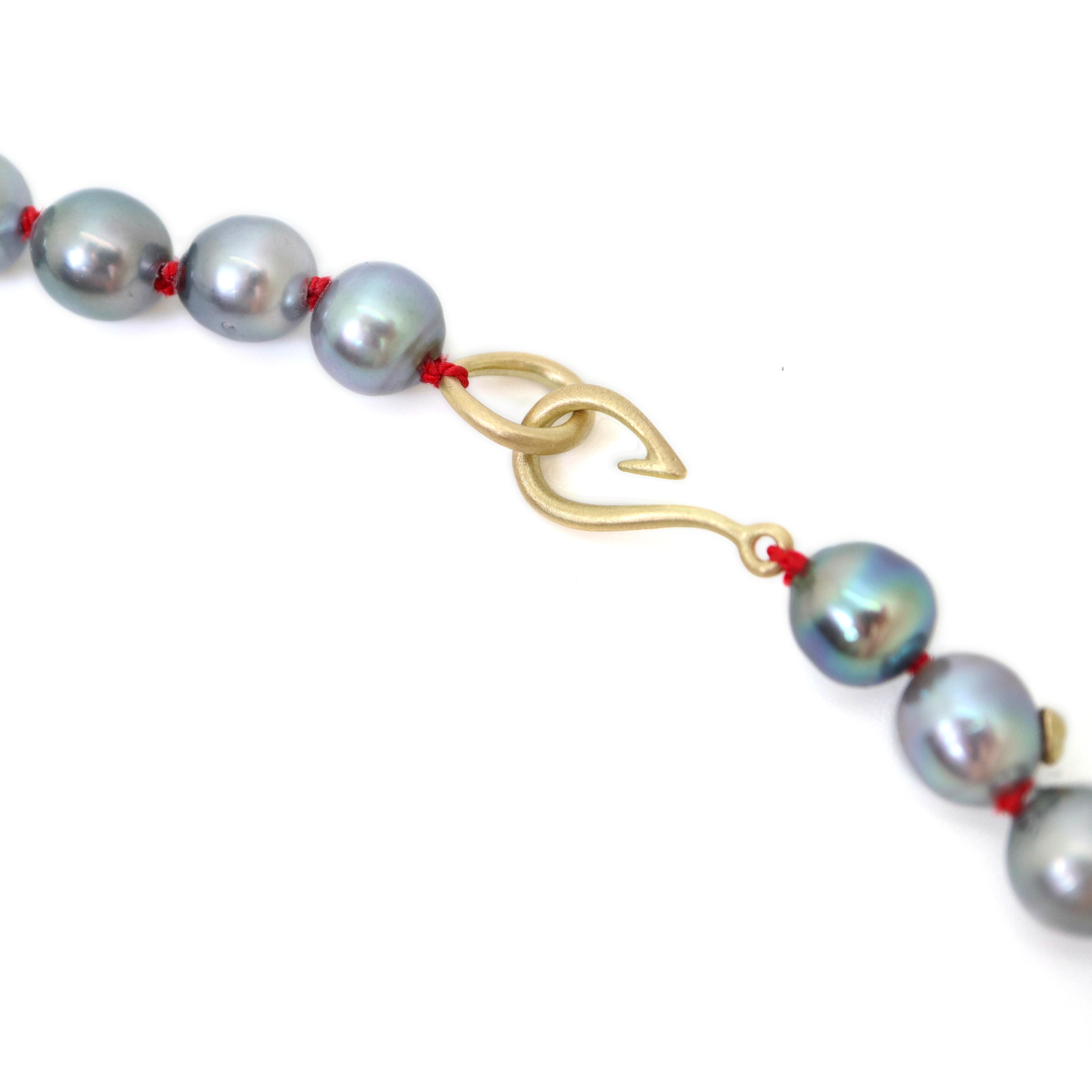 Tahitian black pearls with gold barnacles
