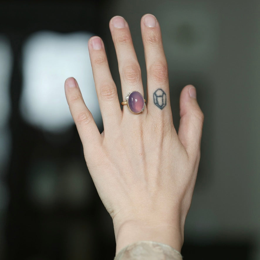 big pink ring on hand