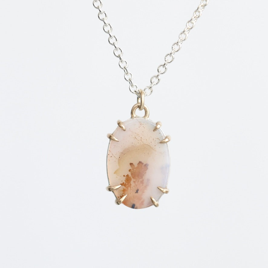 Dendritic agate necklace with gold prongs 