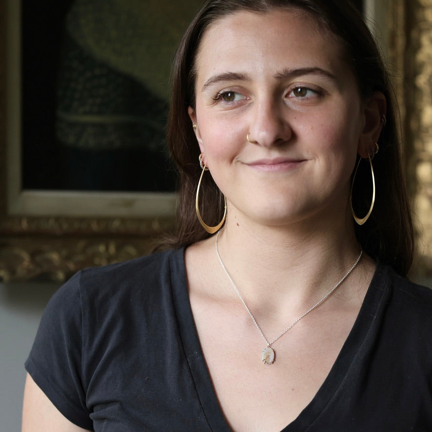 Woman wearing natural gemstone necklace
