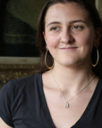 Woman wearing natural gemstone necklace