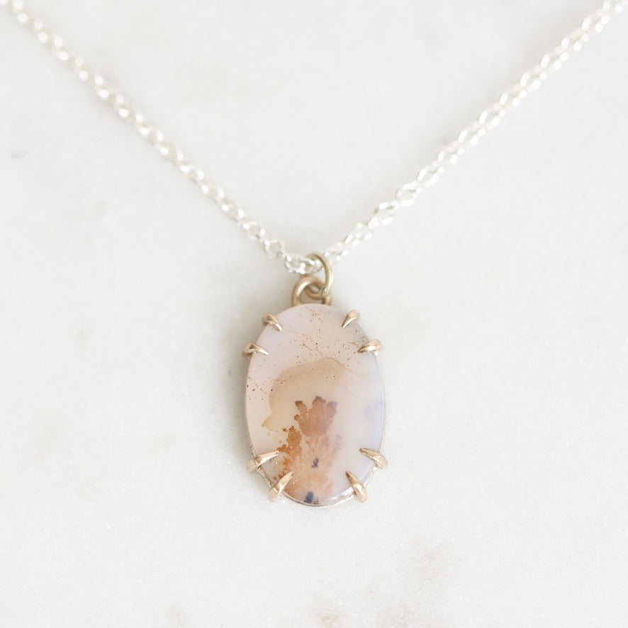 Dendritic agate necklace held in delicate gold prongs
