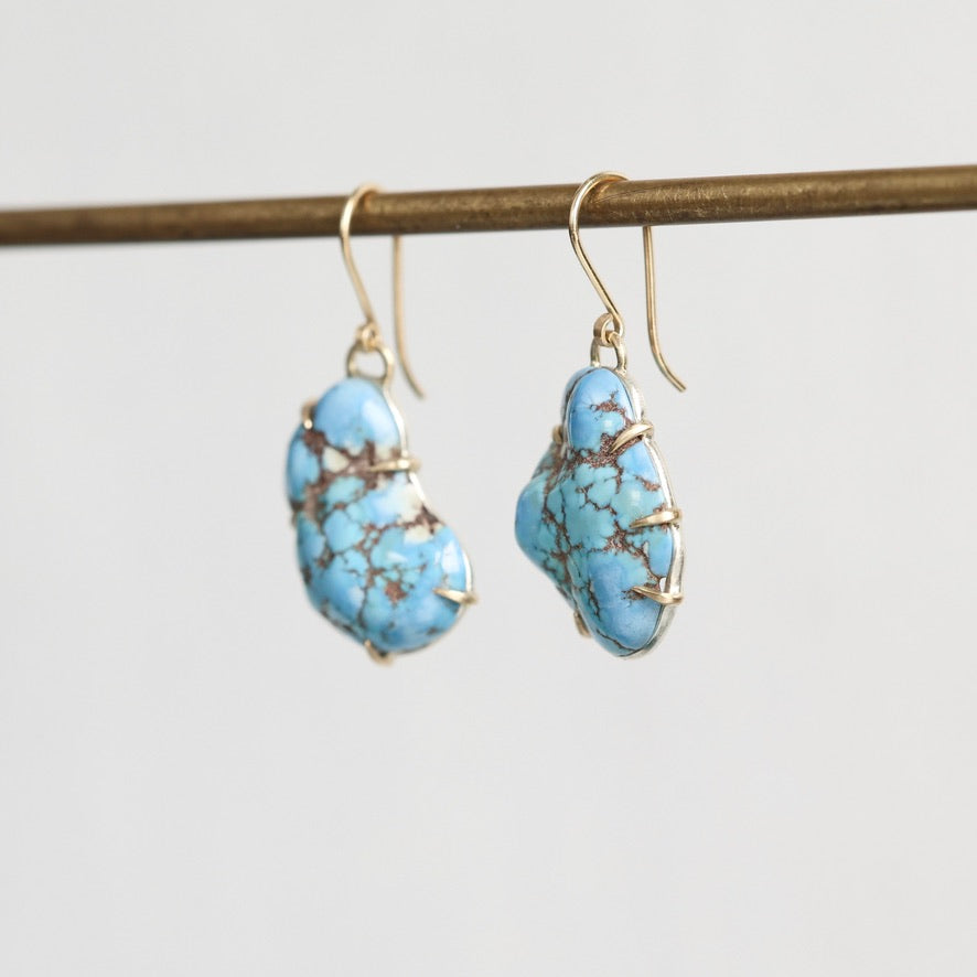 Blue turquoise earrings with gold prongs