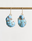 Marbled turquoise earrings in gold prongs