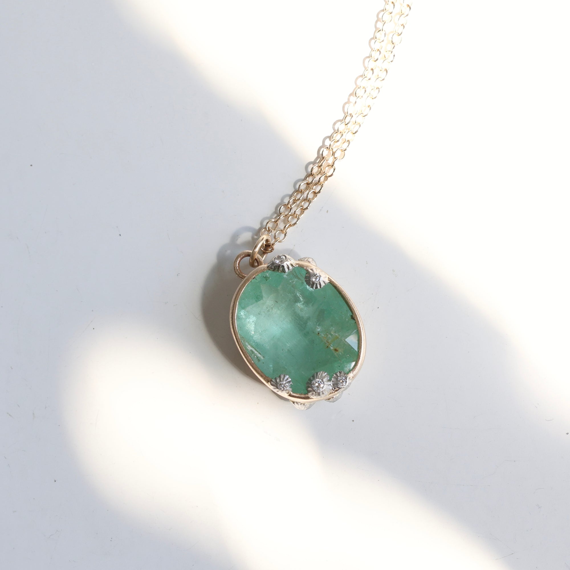 Emerald necklace with barnacle details in the sun