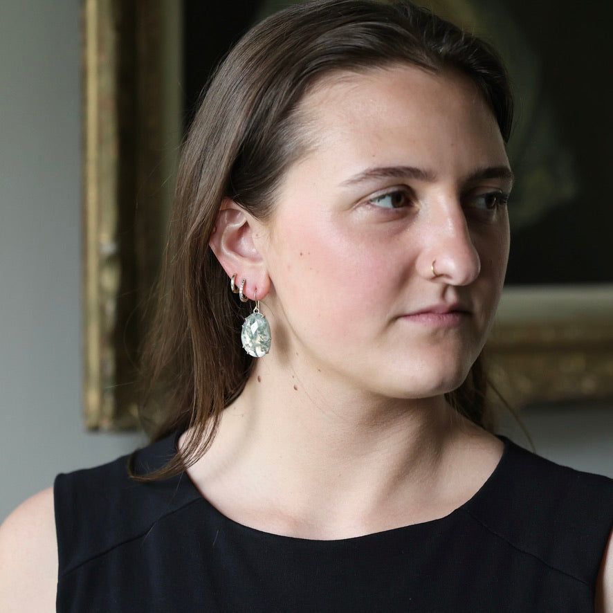 Woman wearing included moss agate earrings