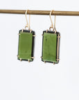 Green stone earrings against white background