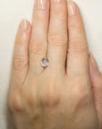 1.835 White Montana Sapphire on hand for scale
