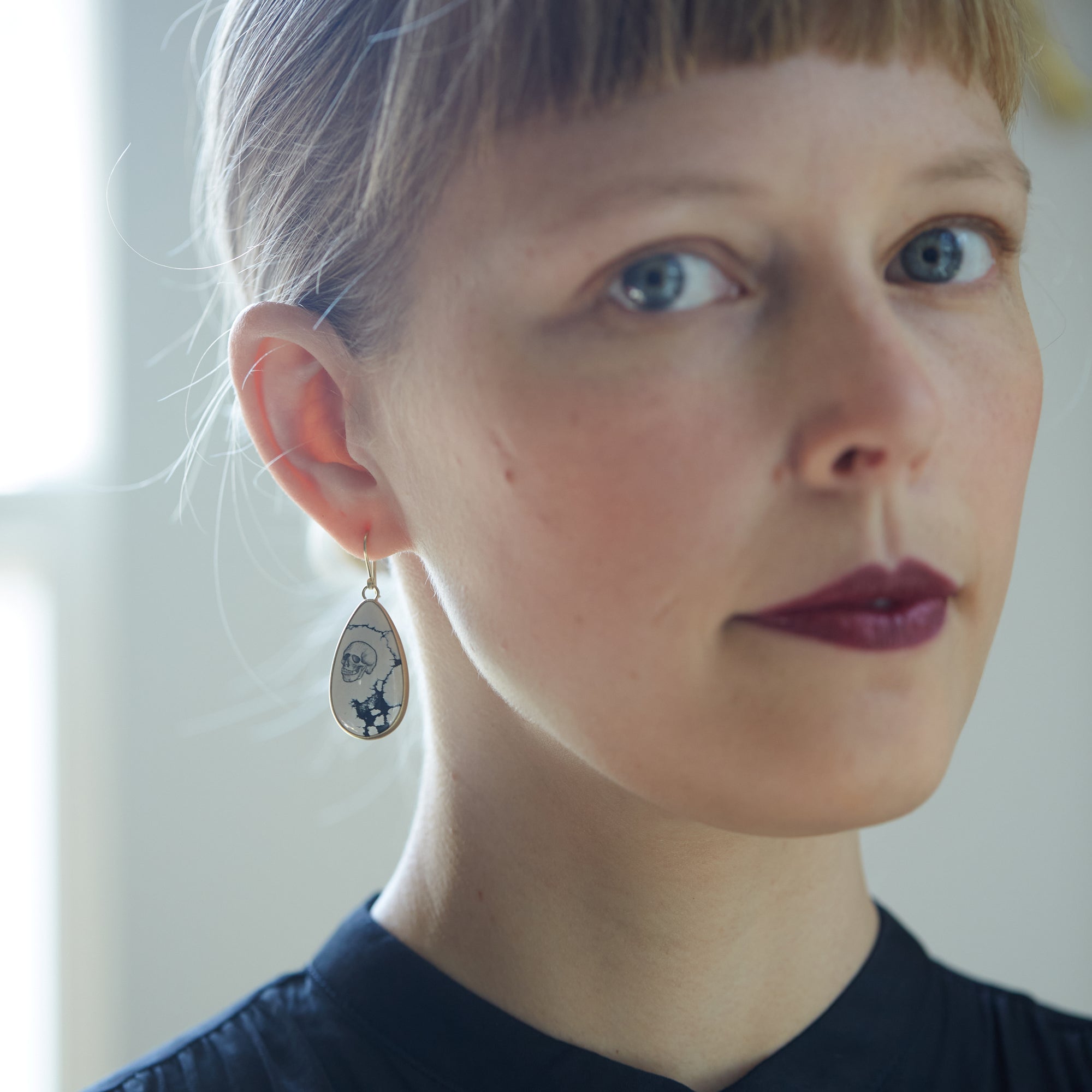 Hand drawn skull and hourglass scrimshaw on variscite - earrings