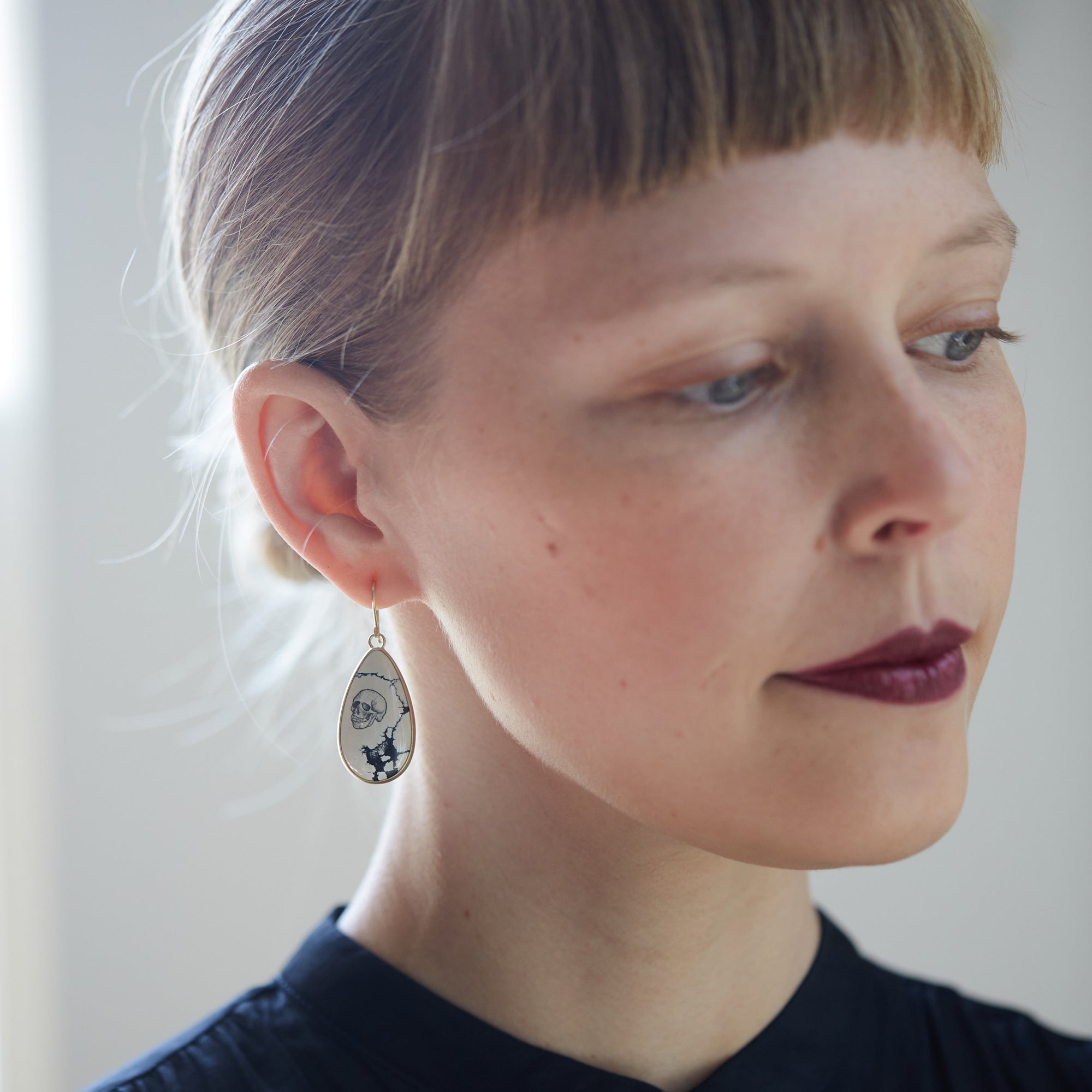 Hand drawn skull and hourglass scrimshaw on variscite - earrings