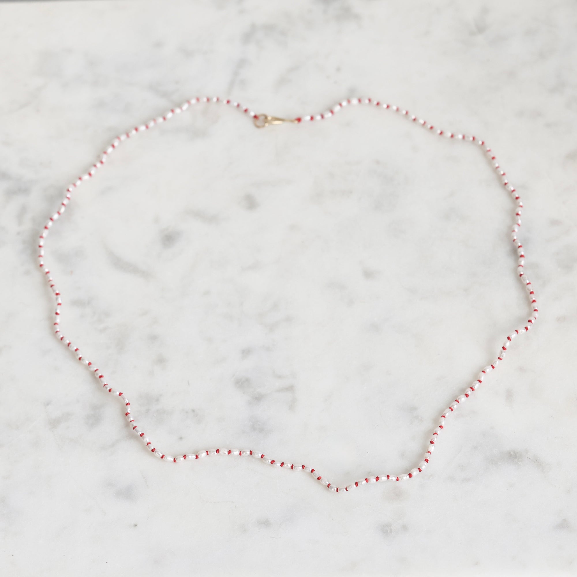 Pearl necklace on a marble surface