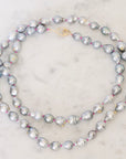 Pearl necklace on a marble surface