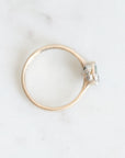 Top view of sapphire bezel set ring. Platinum barnacles with tiny diamonds set in them visible