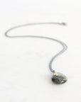Necklace with a pendant on a white background