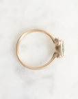 Gold ring with a gemstone on a white background