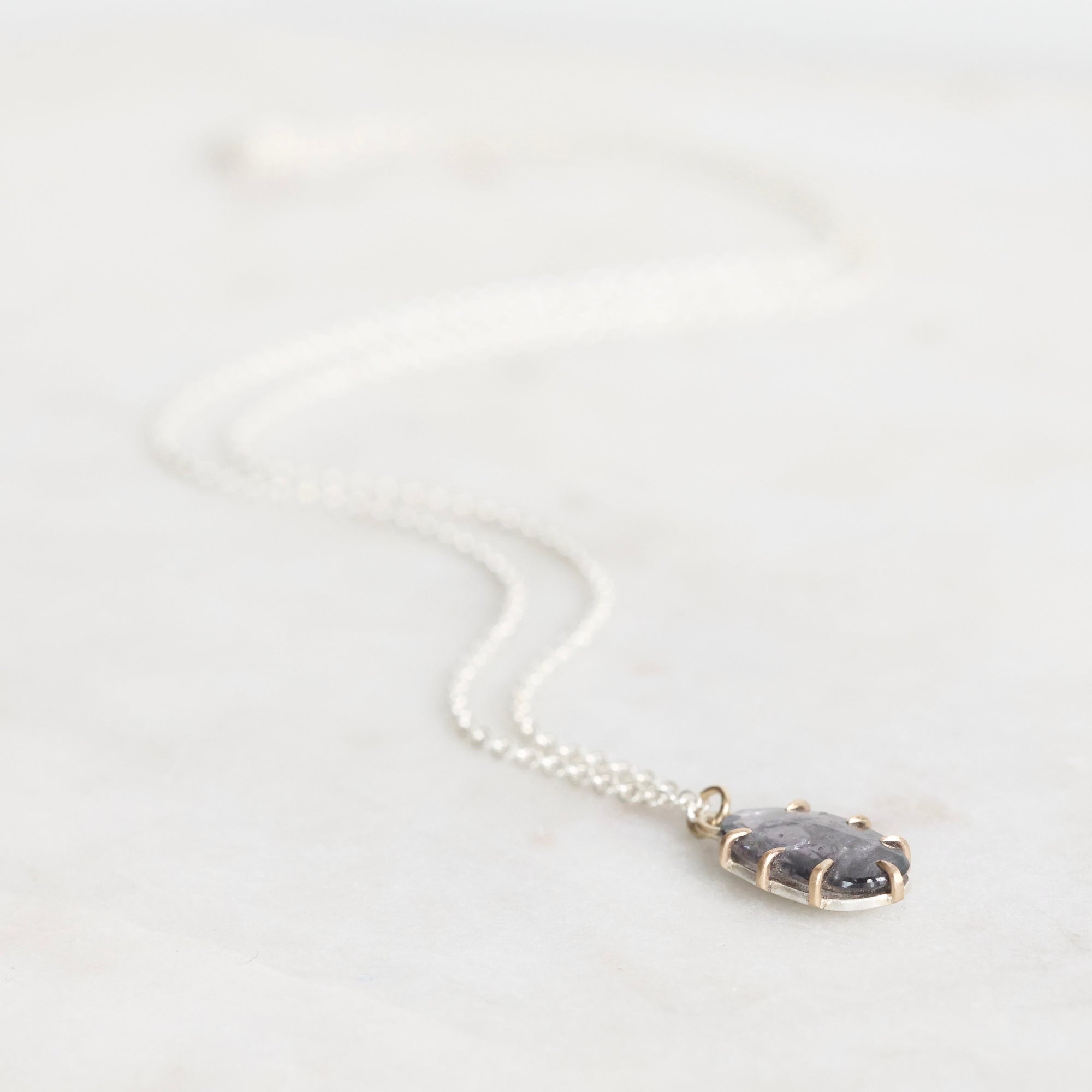Necklace with a pendant on a white background