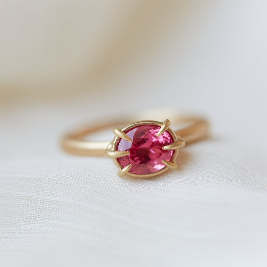 Pink spinel ring in gold with prongs by hannah blount