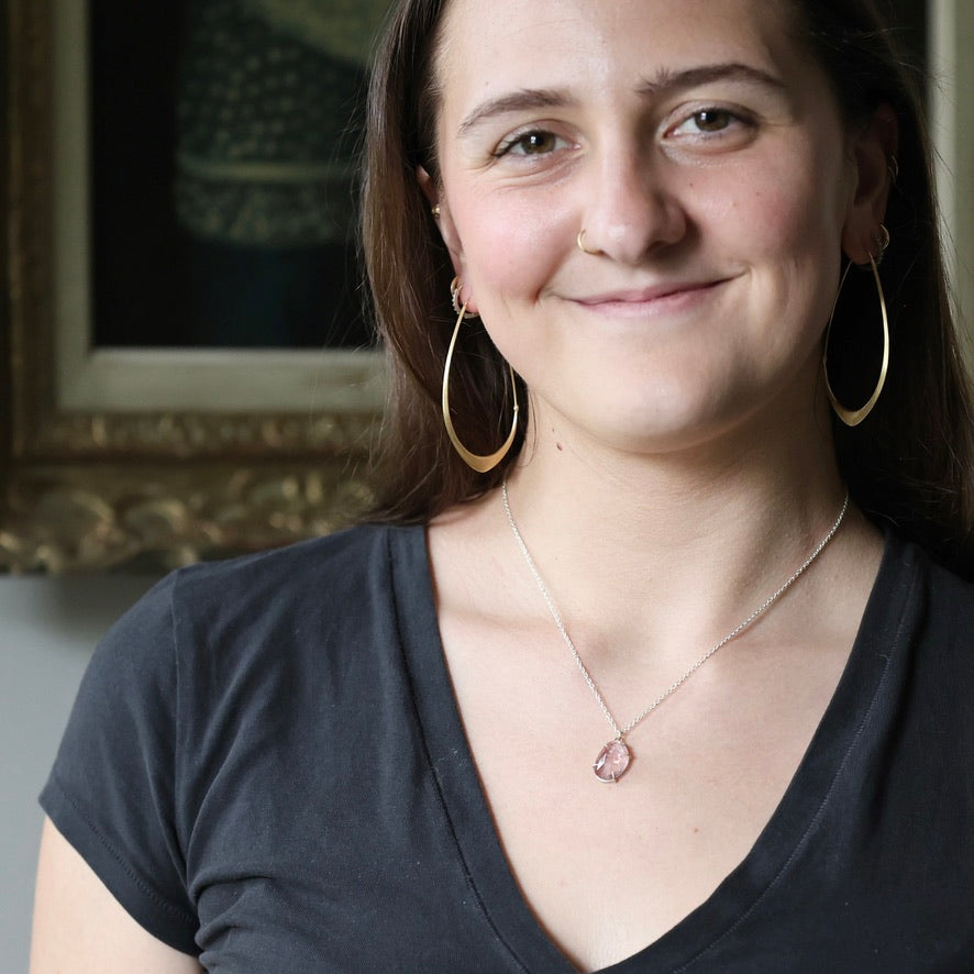 Woman wearing pink stone necklace