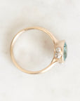 Ring from above gold bezel set with platinum barnacle details. Stone is blue/green.