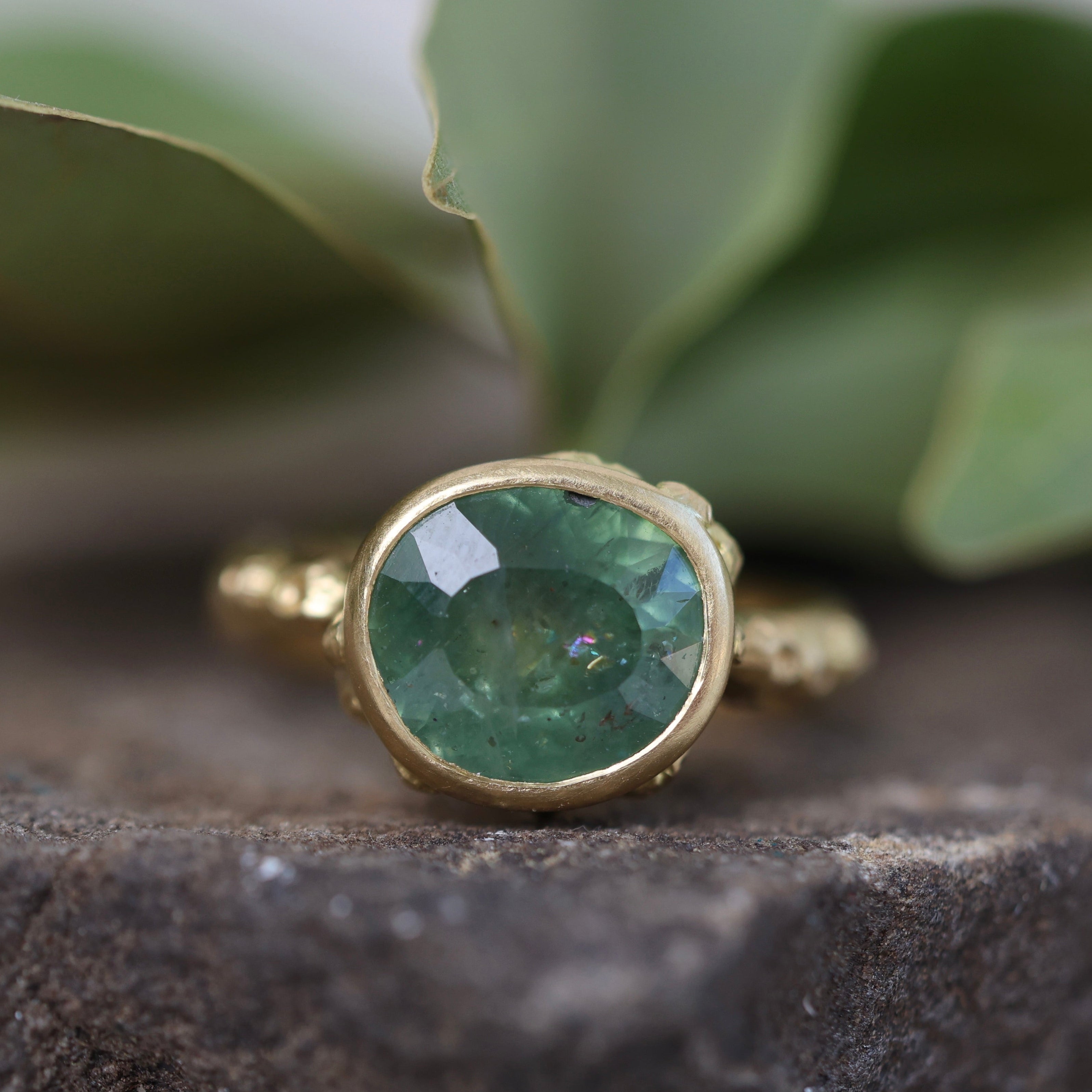 Green Montana Sapphire on rock