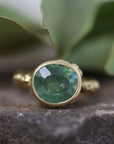 Green Montana Sapphire on rock
