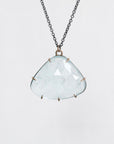 Blue stone necklace in gold prongs
