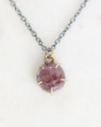 Purple spinel necklace on marble background