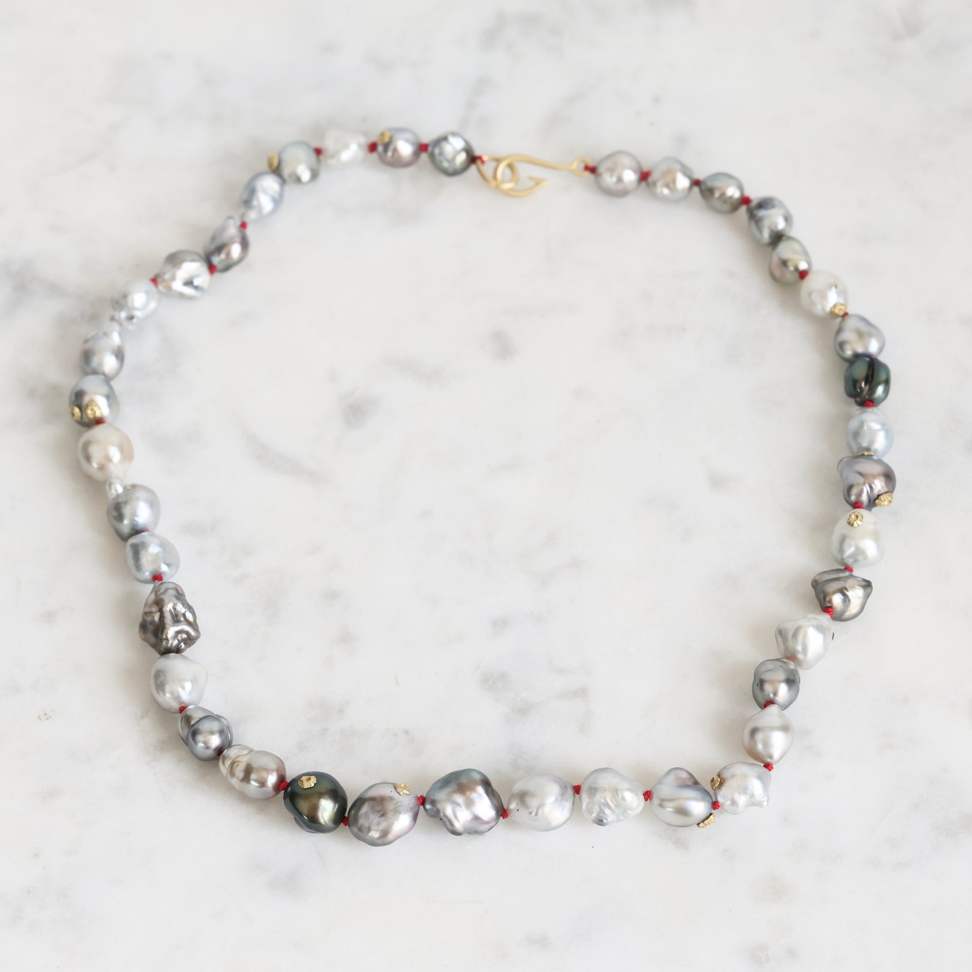 Pearl necklace on a marble surface