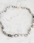 Pearl necklace on a marble surface