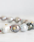 Necklace with pearls on a light background