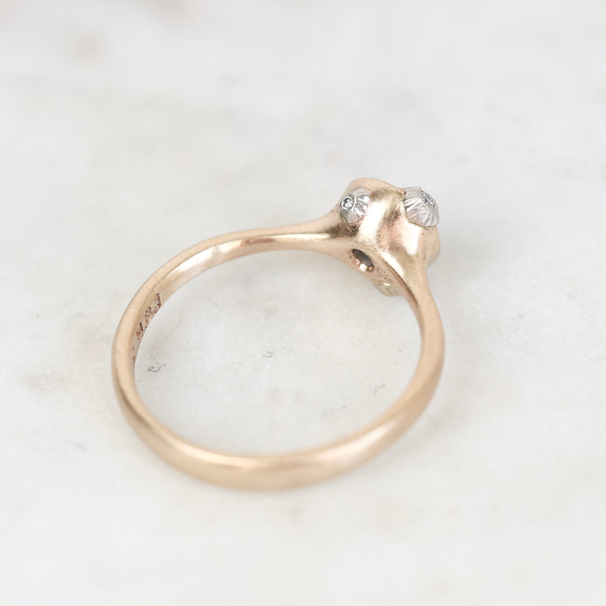 Gold bezel ring with platinum barnacle details. 